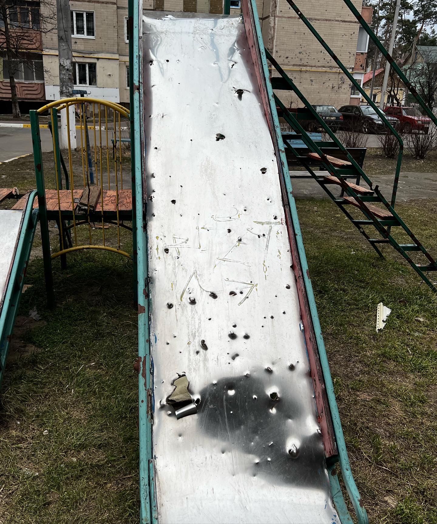 Irpin playground slide riddled with bullet holes